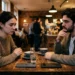 Man en vrouw op date met iPhone en Android telefoon op tafel